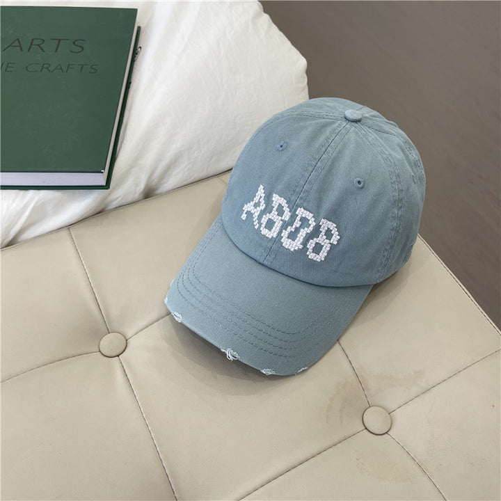 Kvinnens slitte bomull baseballcaps med grafisk detaljer Skanto