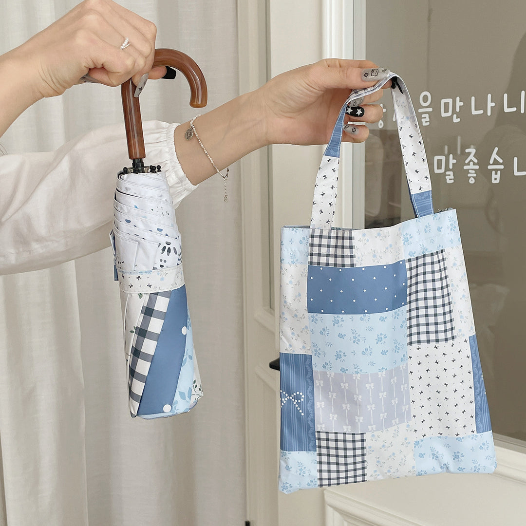 Damer paraply i romantisk patchwork-design Skanto