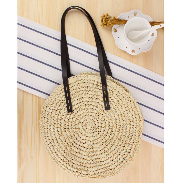 Round basket bag with sturdy leather handles Skanto