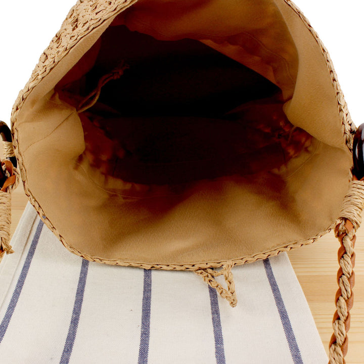 Handbag made of hand-woven natural material with decorative clasp Skanto