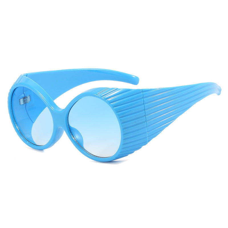 Women's extravagant sunglasses with curved frame Skanto