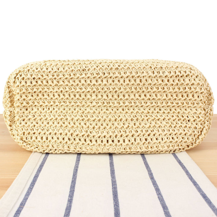 Handbag made of natural woven material with elegant leather straps Skanto