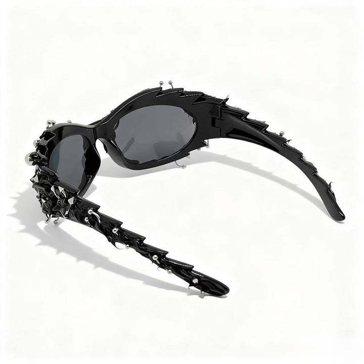 Dame ekstravagant designer solbrille med iøynefallende smykkeinnramming Skanto