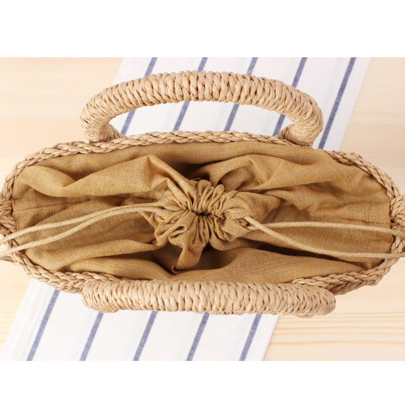 Woven natural material handbag with round handle Skanto