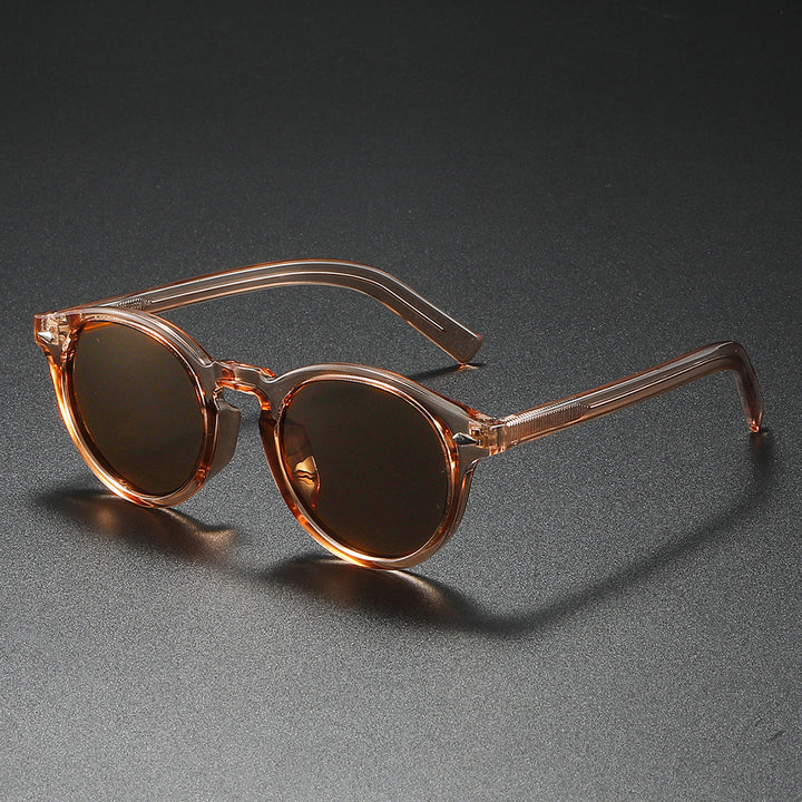 Dame Rund-solbrille med transparent ramme og reflekterende glass Skanto