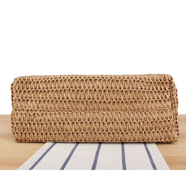 Beach bag made of hand-woven natural material with fringe detail Skanto