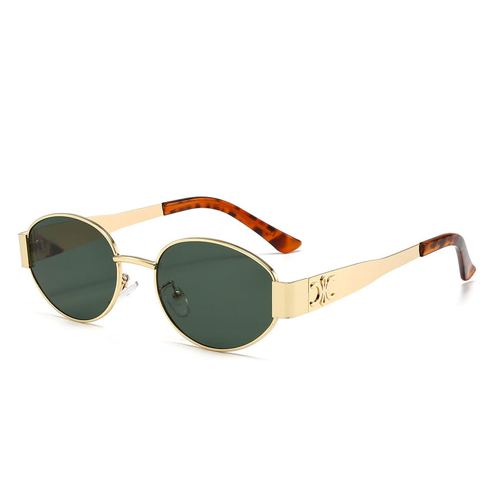 Dame Designer-solbrille med elegant oval ramme og unike aksenter Skanto