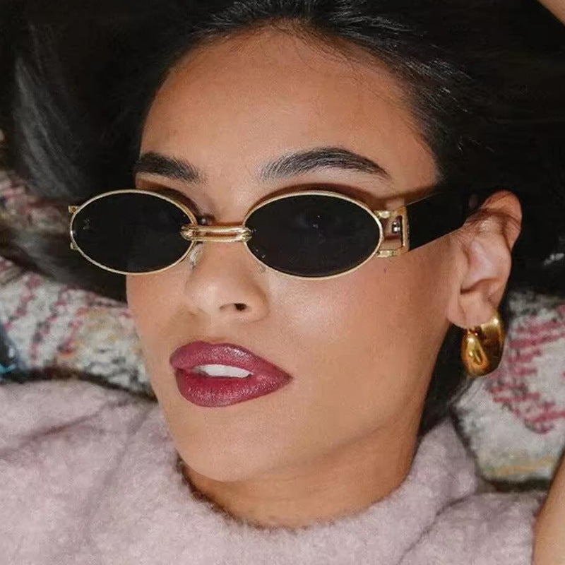 Women's oval sunglasses with golden accents and stylish frame Skanto