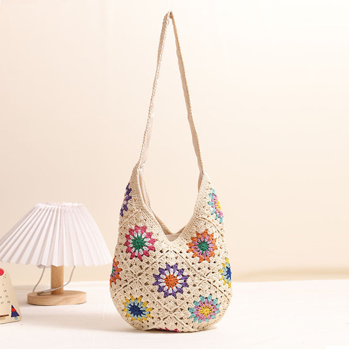 Handmade crocheted bag with colorful floral pattern Skanto
