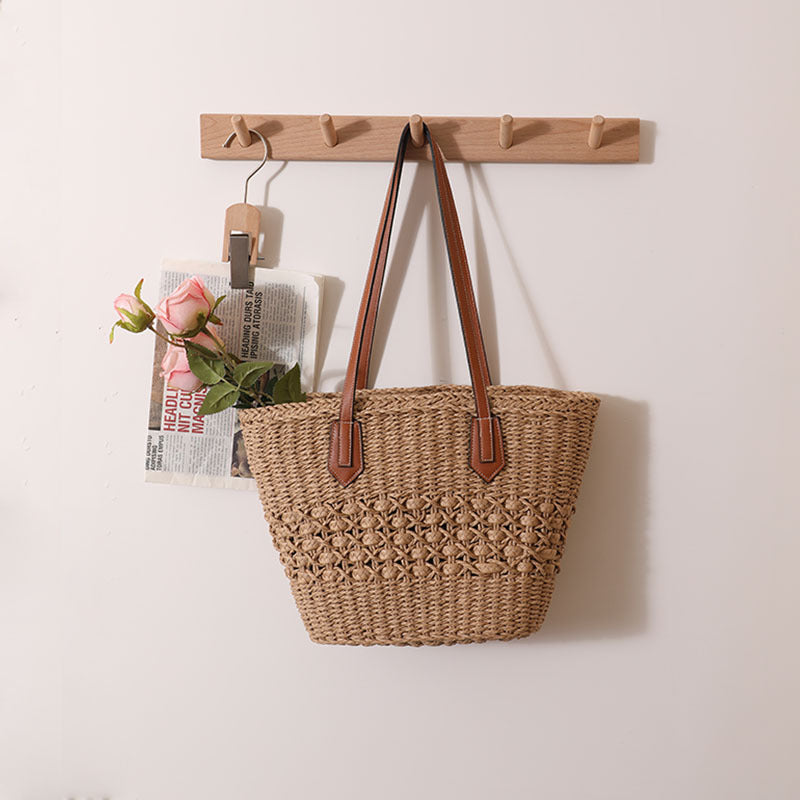 Handmade rattan basket bag with elegant leather details Skanto