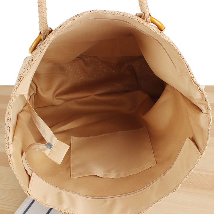 Beach bag in natural woven material with sturdy handles Skanto