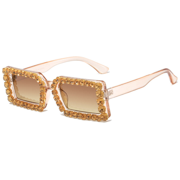 Dame moteriktig solbrille med glitrende rammedekorasjon Skanto