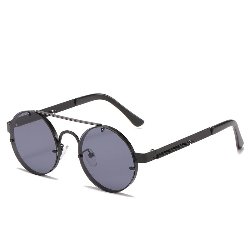 Dame rund designer solbrille med innovativ metallramme og beskyttende linser Skanto