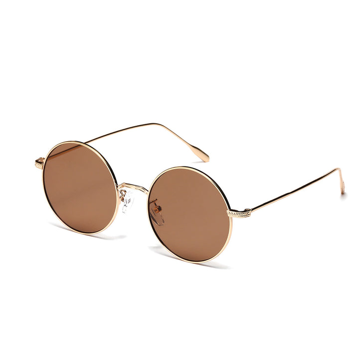 Dame rund moteriktig solbrille med glamorøs ramme Skanto