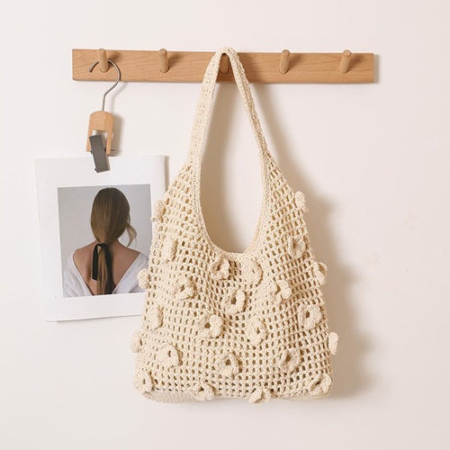 Hand-knotted shoulder bag with floral structural elements Skanto