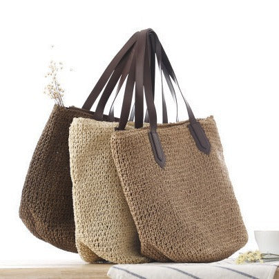 Woven natural material handbag with sturdy leather handles Skanto