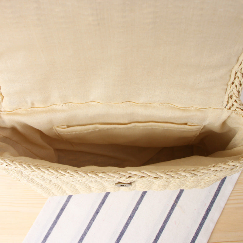Handbag made of braided natural material with detachable shoulder strap Skanto
