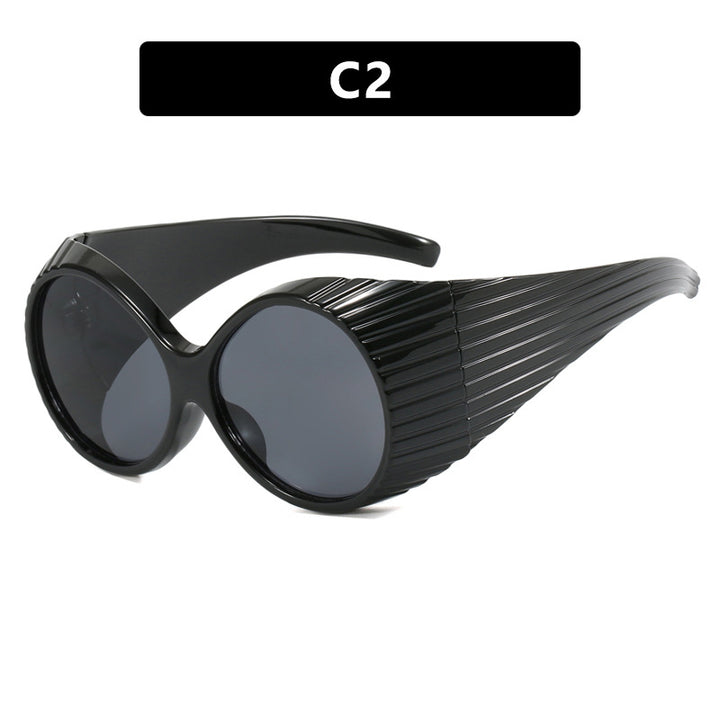 Women's extravagant sunglasses with curved frame Skanto