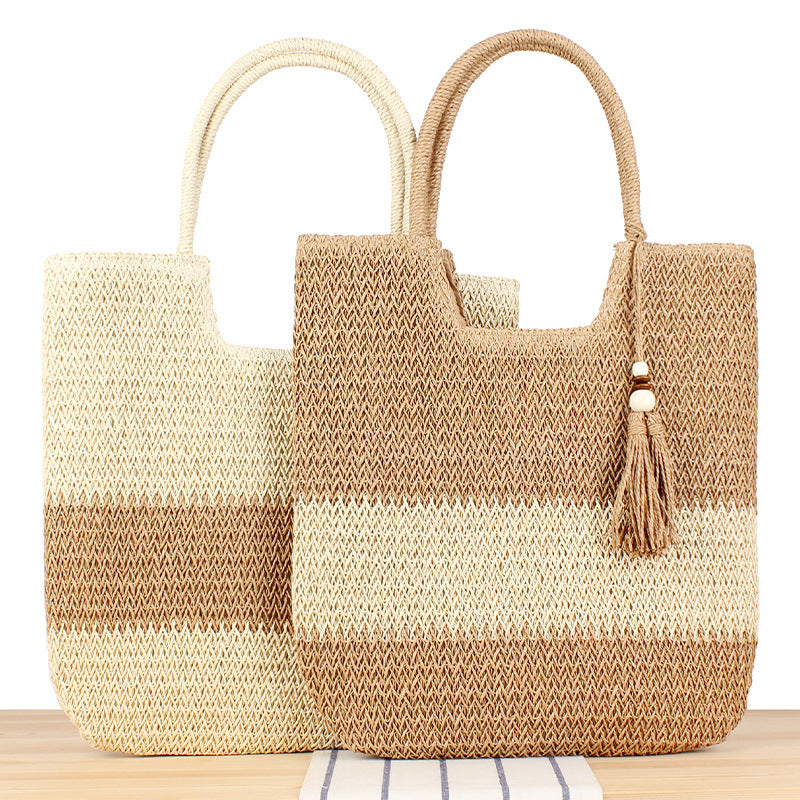 Modern beach tote bag made of woven natural material with fringed details Skanto