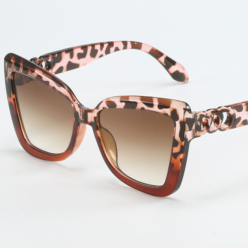 Dame moderne Cat-Eye solbriller med klar ramme og UV-beskyttelse Skanto