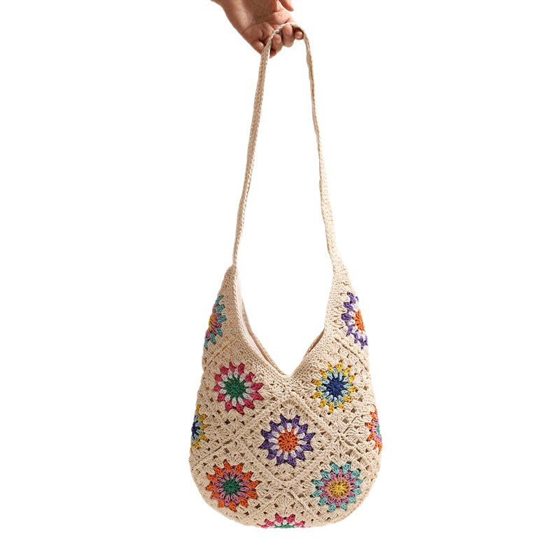 Handmade crocheted bag with colorful floral pattern Skanto
