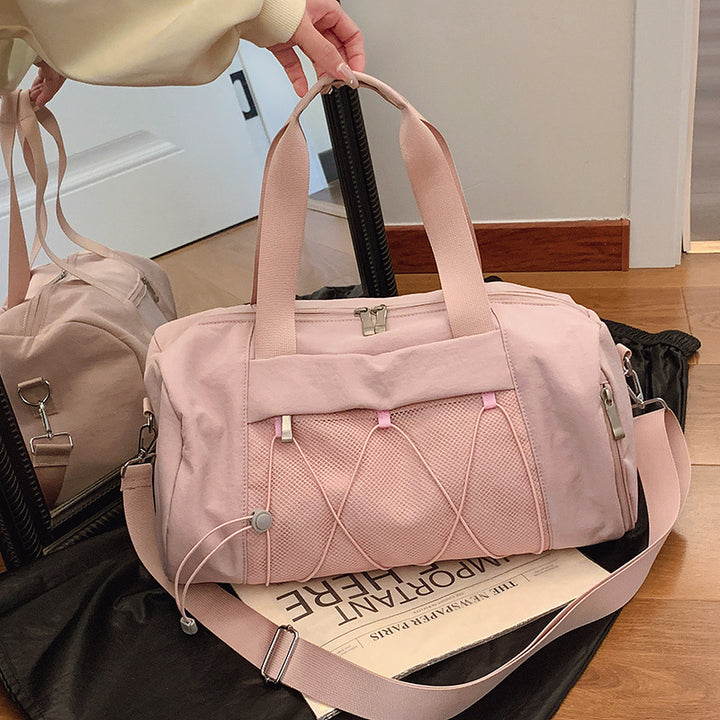 Sporty crossbody bag with adjustable carrying handles and breathable mesh material Skanto