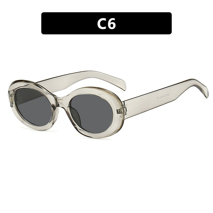 Women's fashionable sunglasses in original oval design with transparent frame and UV protection Skanto