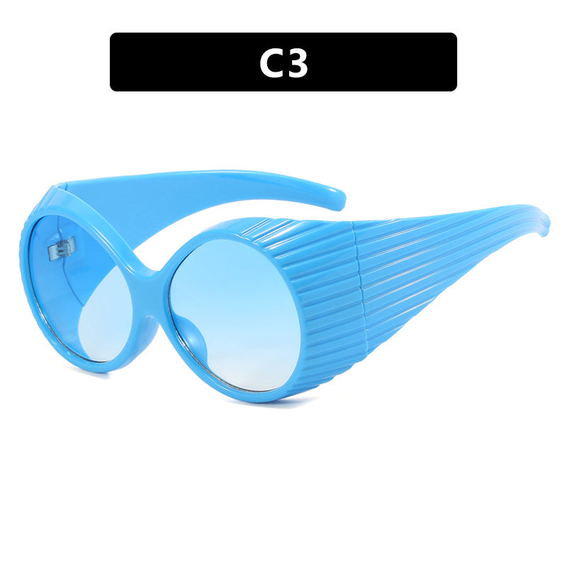 Women's extravagant sunglasses with curved frame Skanto