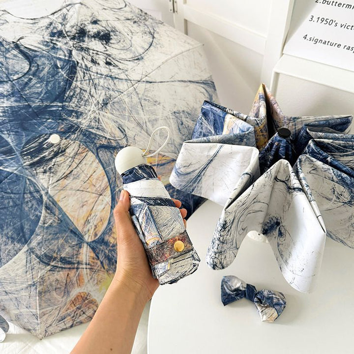 Dame sammenleggbart paraply med kunstnerisk design og automatisk åpne mekanisme Skanto