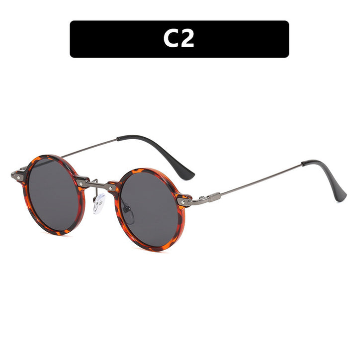 Dame rund solbrille med moderne metallramme og store blå linser Skanto