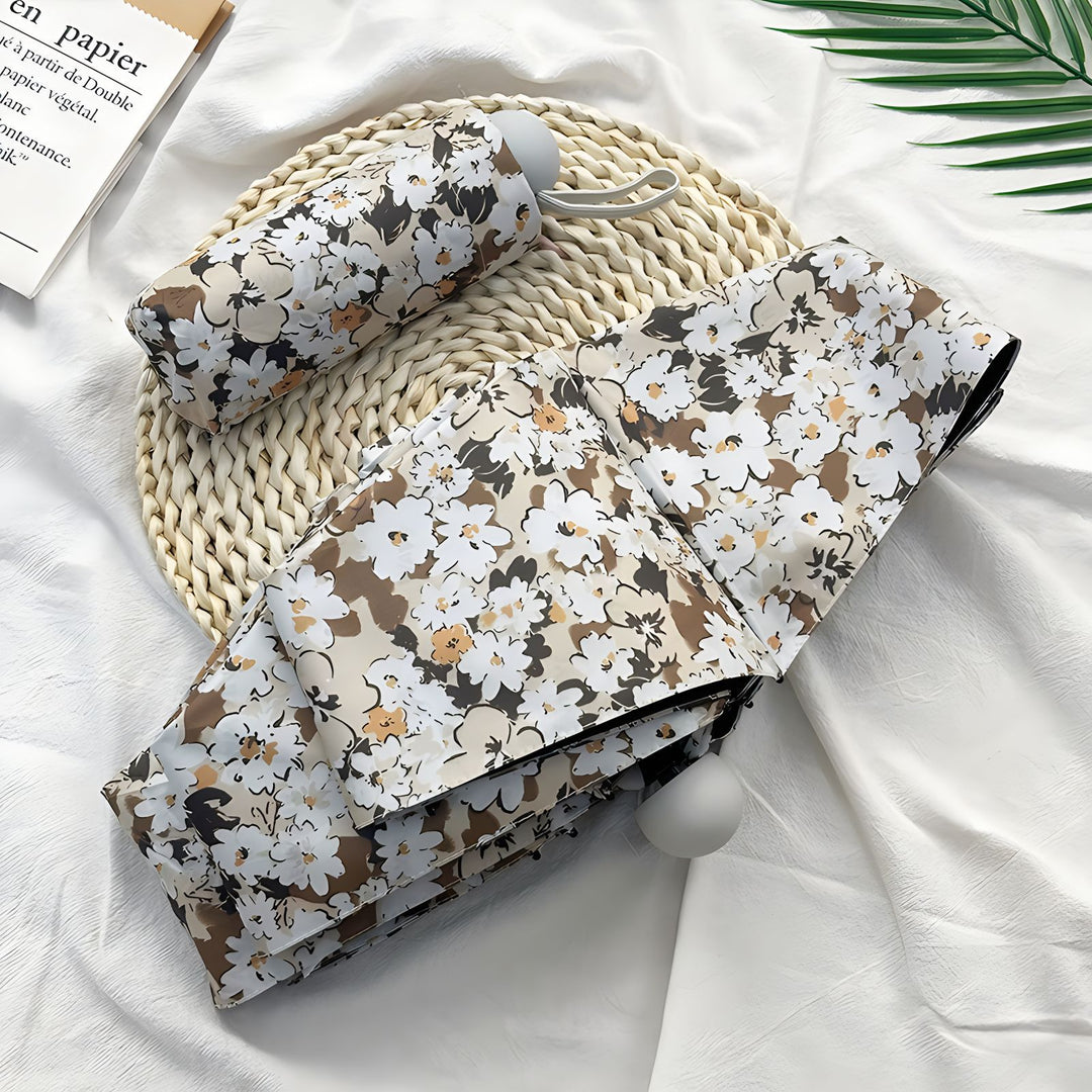 Damer Sammenleggbart paraply med elegant blomsterdesign Skanto