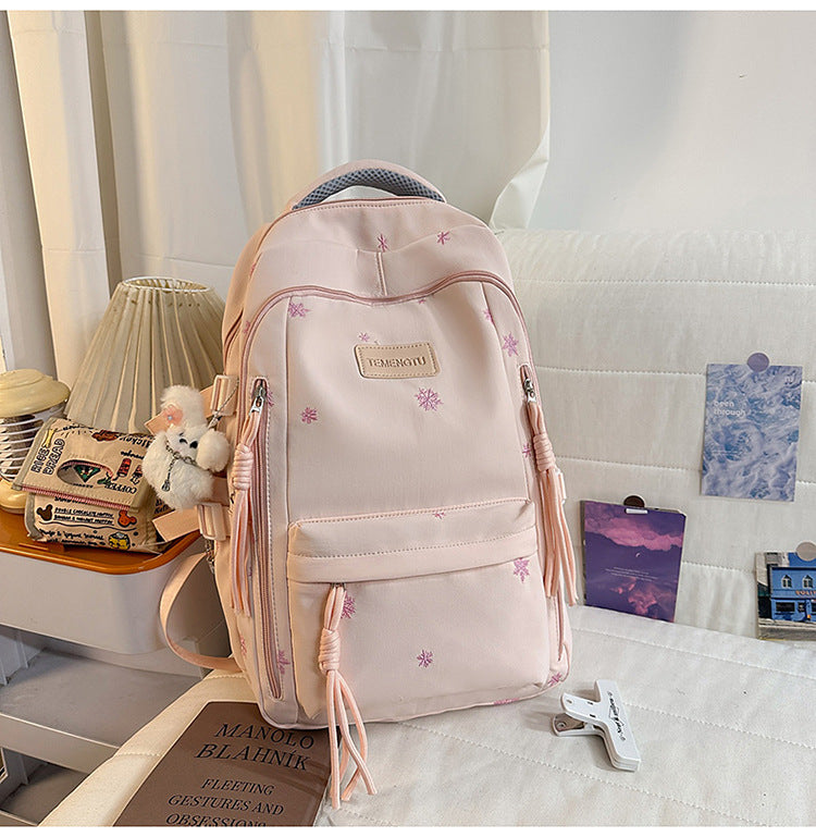 Elegant brodert skole ryggsekk