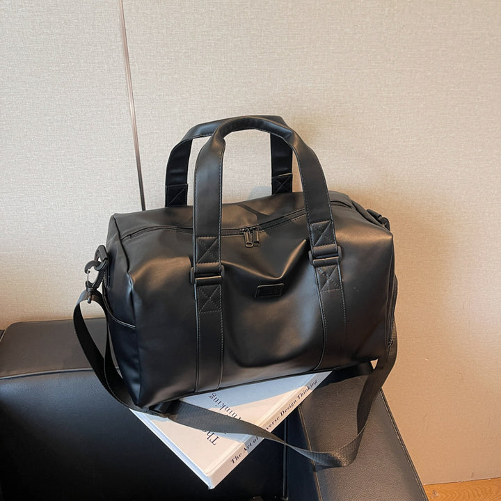Sporty duffel bag with durable water-repellent material and versatile carrying options Skanto