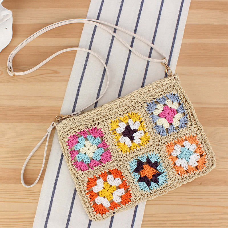 Hand-knotted shoulder bag with colorful floral design Skanto