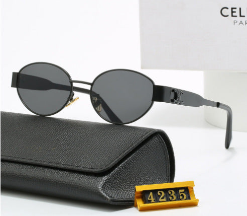 Dame elegant oval solbrille med gullfarget ramme Skanto