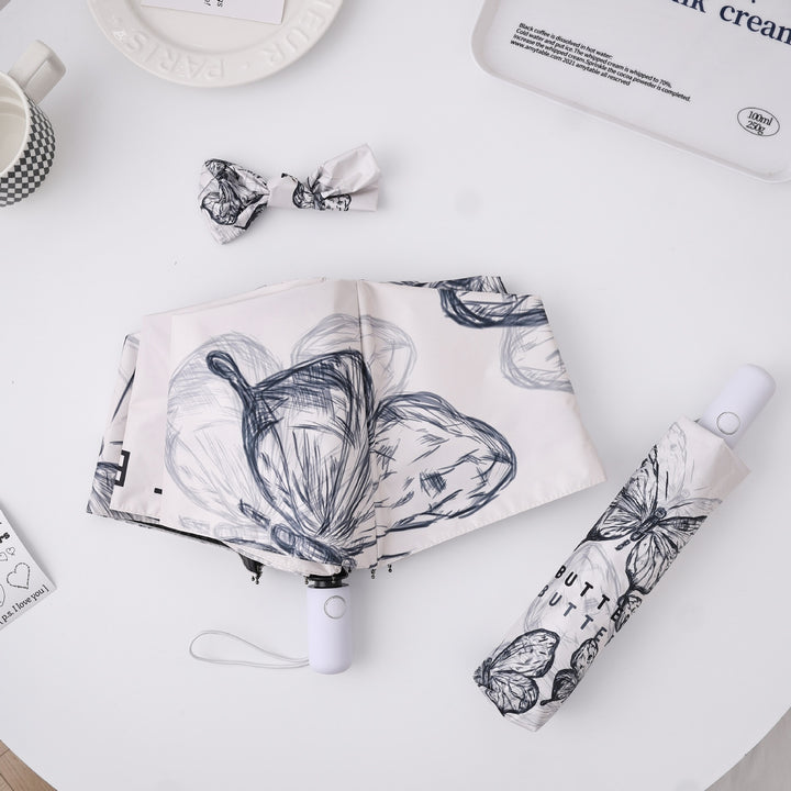 Dame fashionable foldeparaply med leken design Skanto