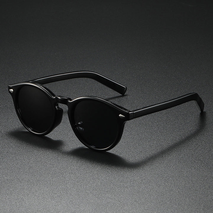 Dame Rund-solbrille med transparent ramme og reflekterende glass Skanto