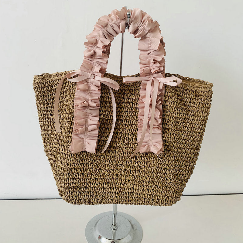 Heklet strandveske med elegante satinfinesser Skanto