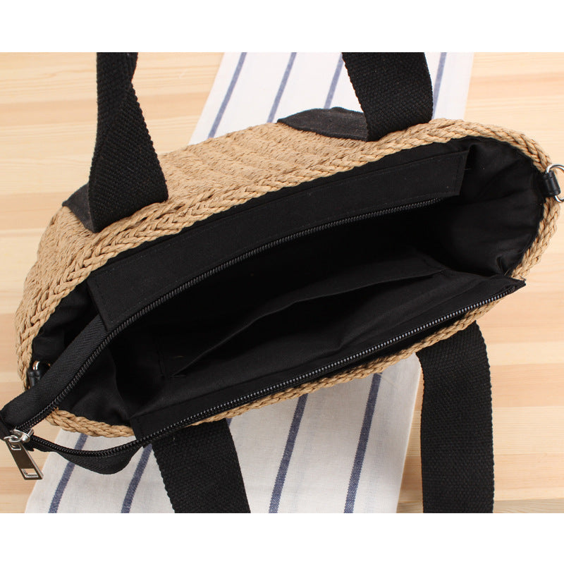 Handbag made of woven natural material with adjustable shoulder strap Skanto
