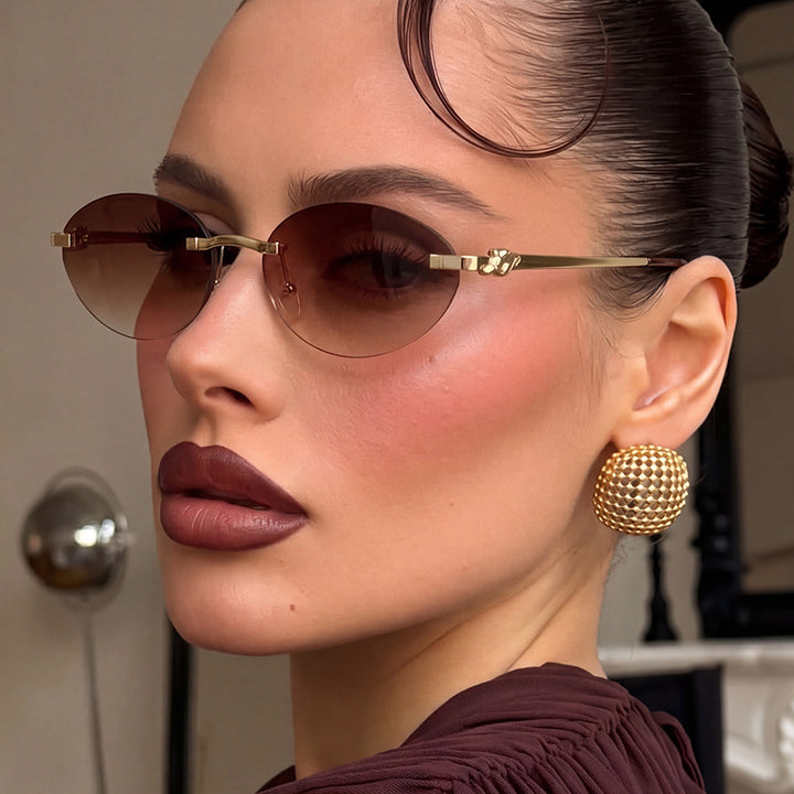 Women's elegant oval sunglasses with gold accent Skanto