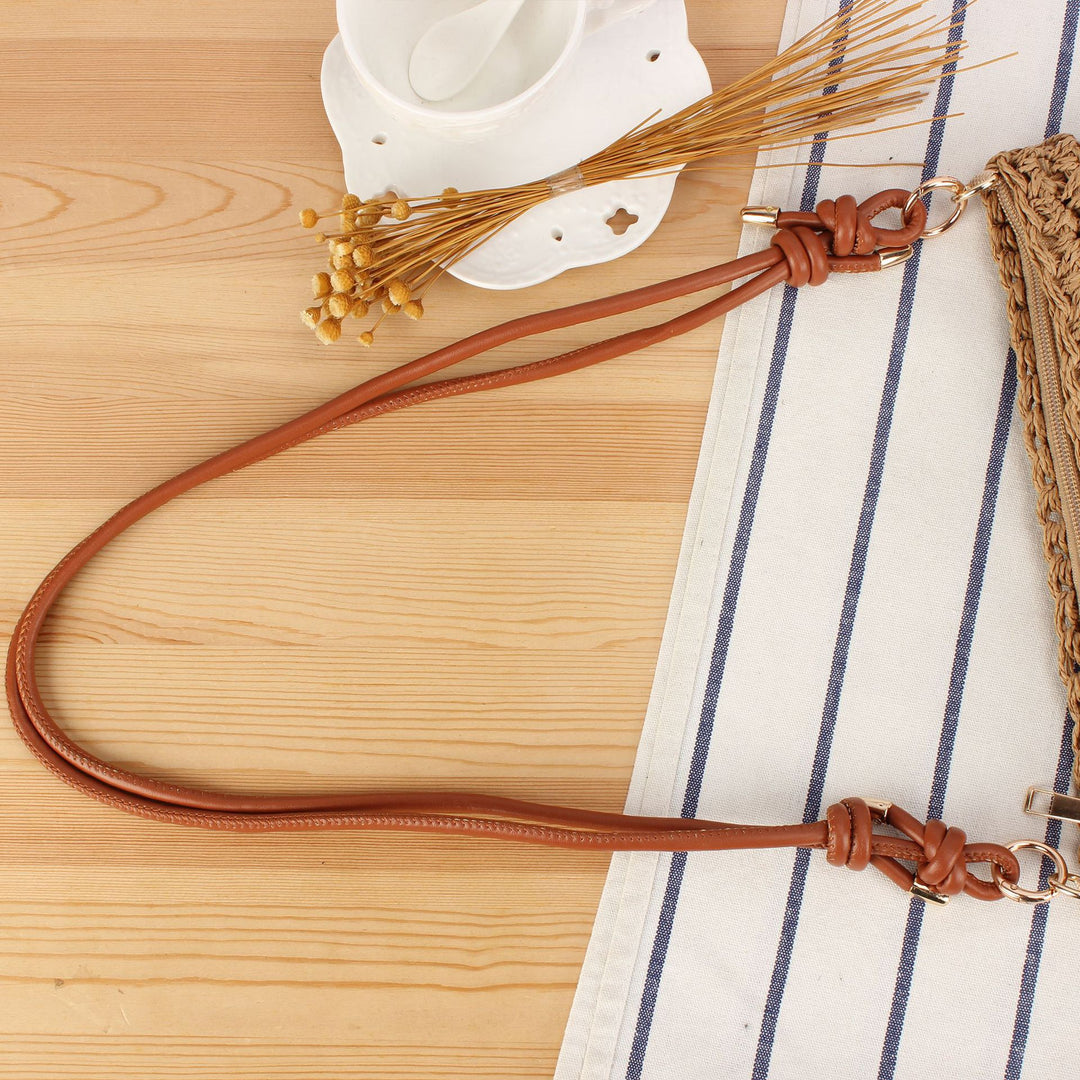 Handbag made of braided natural material with elegant button closure Skanto