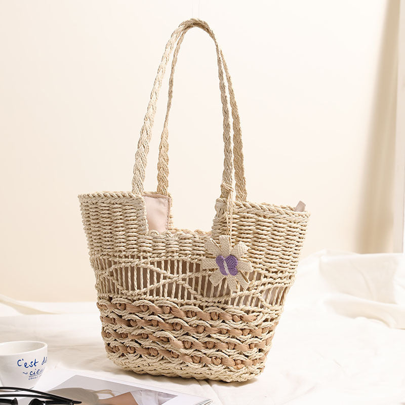 Braided basket bag with decorative floral appliqué Skanto