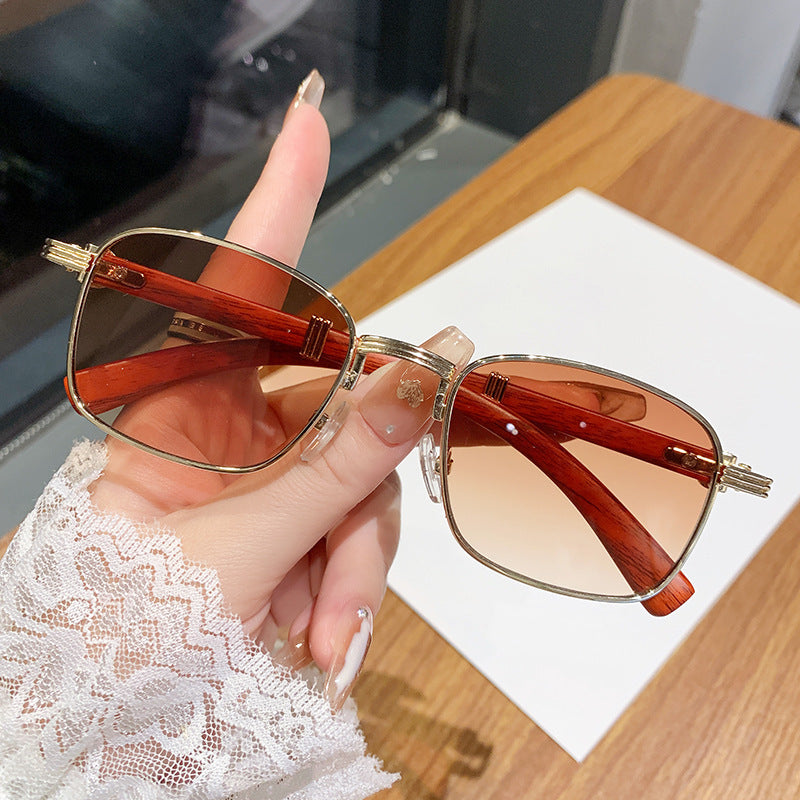 Dame solbrille med luksuriøs treinnfatning Skanto