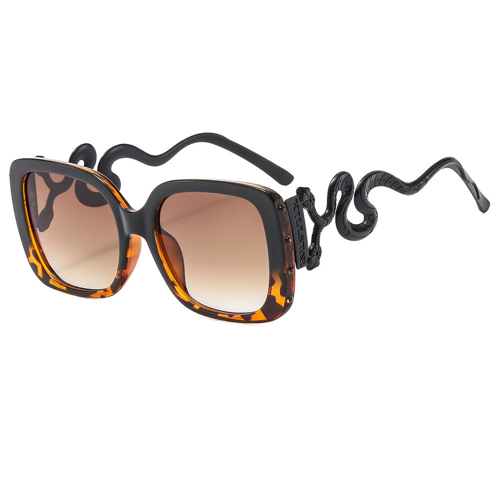 Dame ekstravagant designer solbrille med luksuriøs slangeramme Skanto
