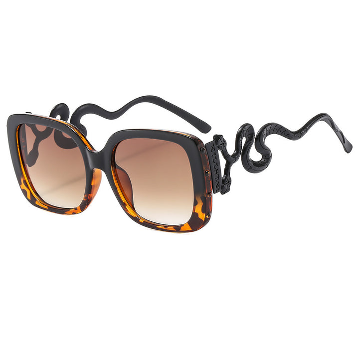 Dame ekstravagant designer solbrille med luksuriøs slangeramme Skanto