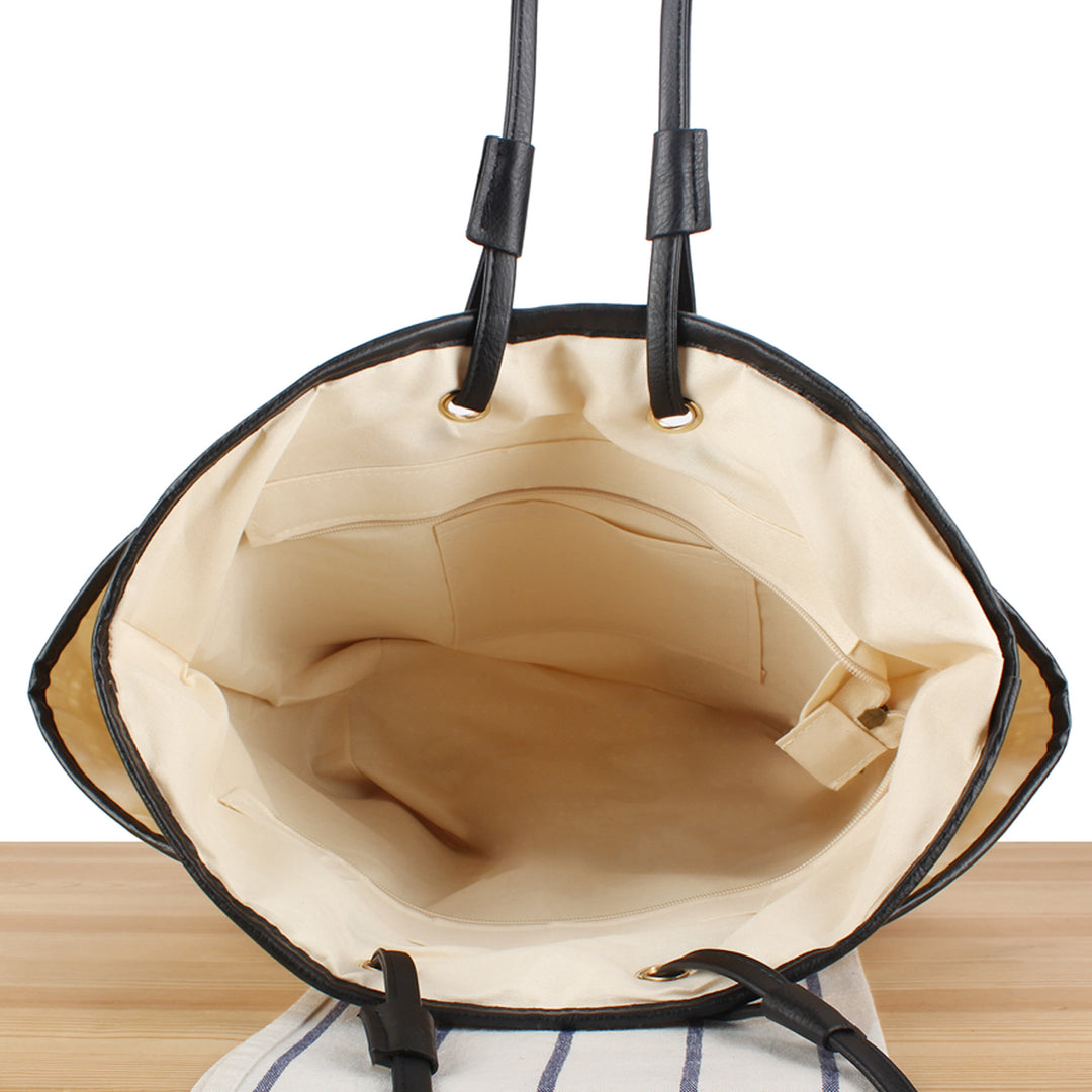 Tote bag with thoughtful compartment design and durable leather handles Skanto