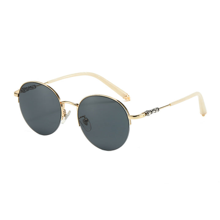 Dame rund solbrille med elegant metallramme og komfortable nesepads Skanto