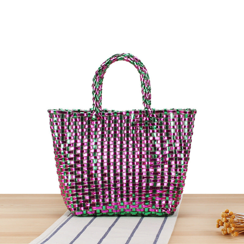 Handbag made of woven natural material with elegant accents Skanto