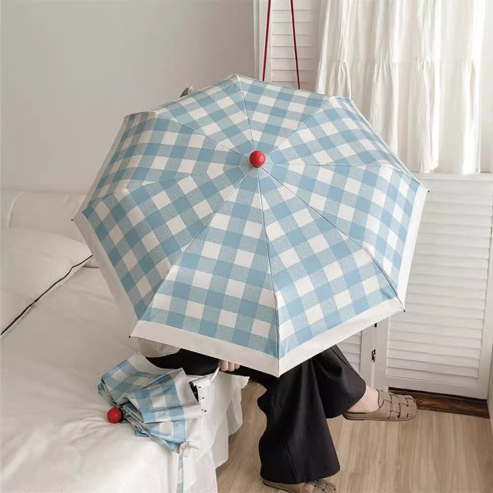Dame sammenleggbart paraply med spesiell design Skanto