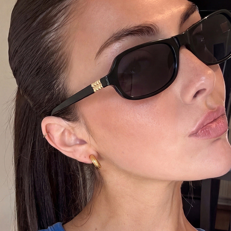 Women's trendy stylish sunglasses with golden accents Skanto